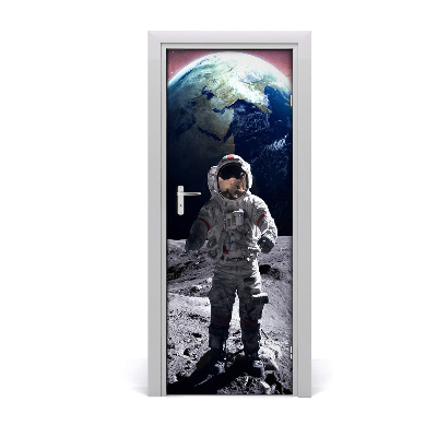 Fototapeta na dvere Astronaut na zemi