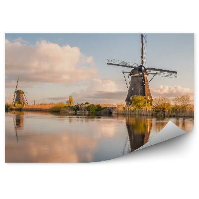 Fototapeta na stenu Odsev mlinov na veter v vodni pokrajini