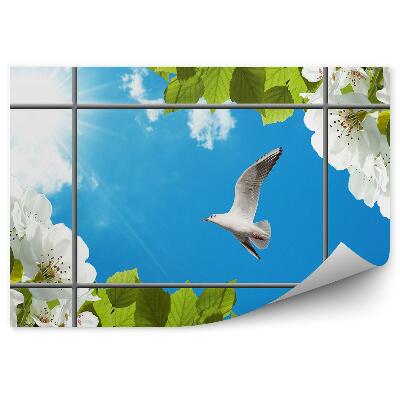 Fototapeta na stenu Biely vták kvitnúci strom modrá obloha