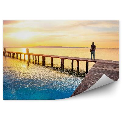 Fototapeta Mólo Ľudia Oceán Obloha Mraky Západ Slnka