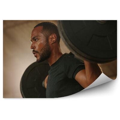 Fototapeta na stenu Moški bodybuilder, ki dviguje uteži