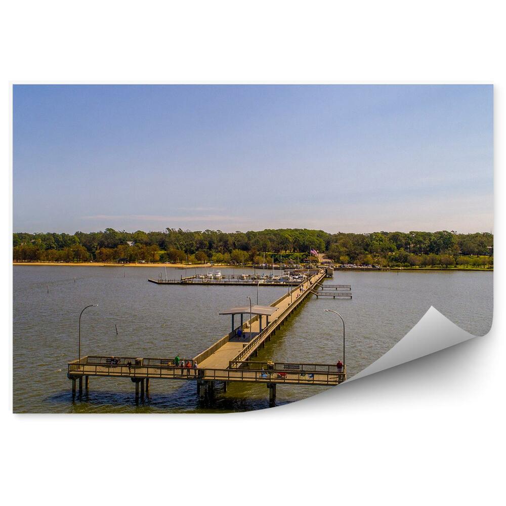 Fototapeta Turistické mólo voda zelená vegetácia