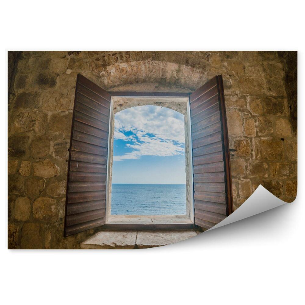 Fototapeta na stenu Okno v stene starej pevnosti pohľad na more