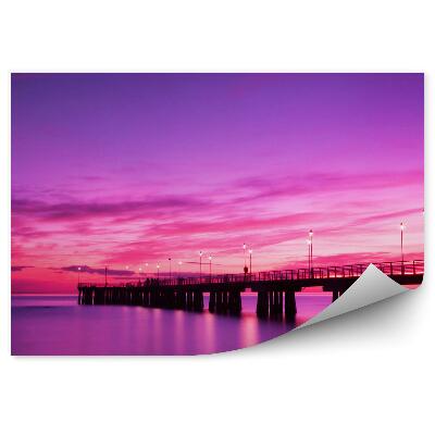 Fototapeta Ružovofialové svetlo pri západe slnka mólo