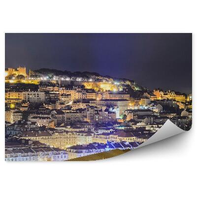 Fototapeta na stenu Pohľad z vtáčej perspektívy budovy pri západe slnka lisabonský hrad noc