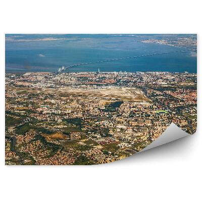 Fototapeta Pohľad z vtáčej perspektívy na budovy pri západe slnka lisabon oceán Portugalsko