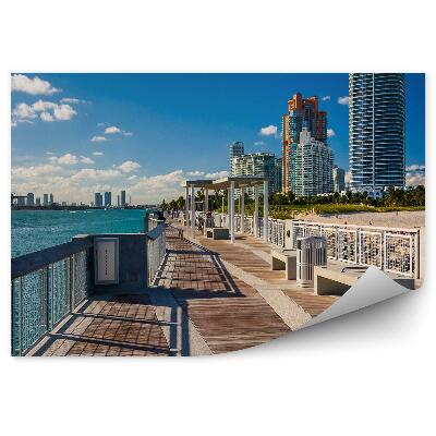 Fototapeta na stenu Mrakodrapy Stromy Ľudia Pláž Mólo Mrakodrapy Oceán Obloha Mraky