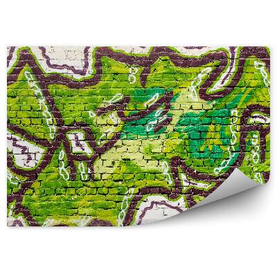 Fototapeta Zelené graffiti na béžovej tehlovej stene