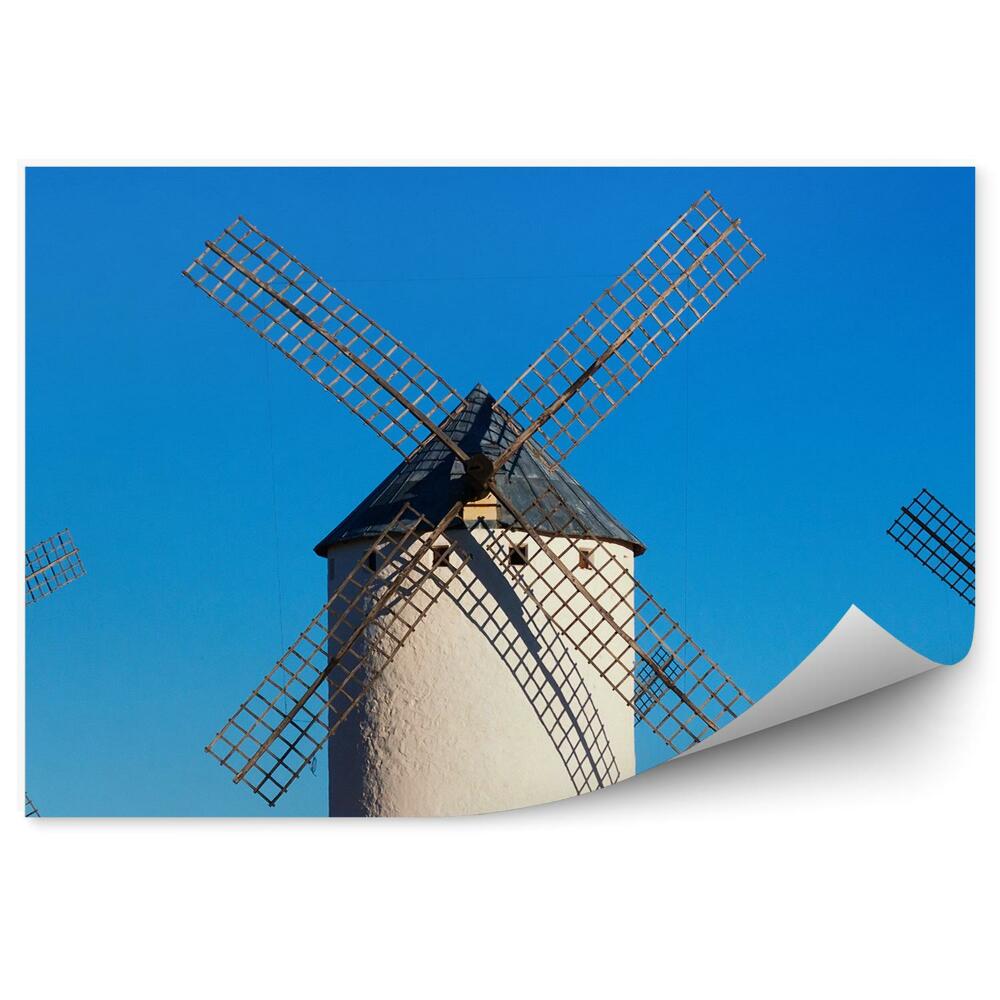Fototapeta Trije veliki beli mlini na veter na modrem nebu
