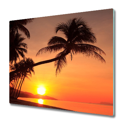 Sklenená doska na krájanie Palma na pozadí pri západe slnka