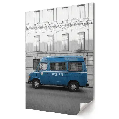 Plagát do obývačky Modré policajné auto v mestskej krajine